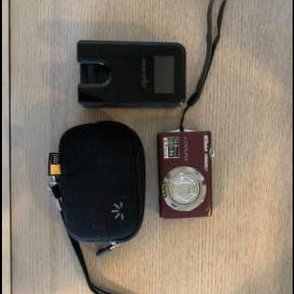 Nikon Coolpix camera, camera case, memory card, and portable battery charger